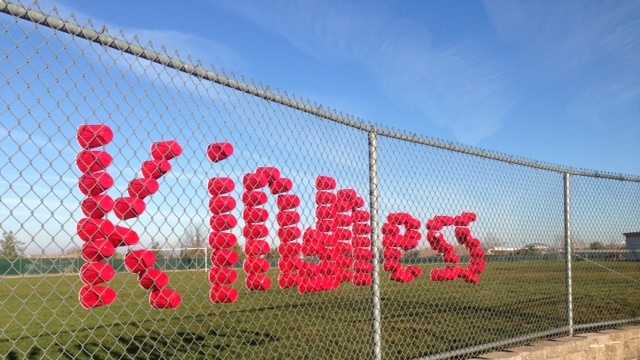 Red Solo cups are inserted on a fence at Rocklin Academy's Turnstone campus to spell out the theme of this week at their school.