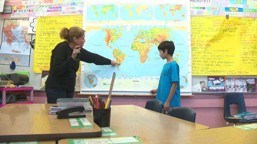 Kim Williams, a 6th-grade teacher at Leonardo DaVinci Elementary School in Sacramento, talks with her student, Aidan Fong, about their planned trip to Antarctica.