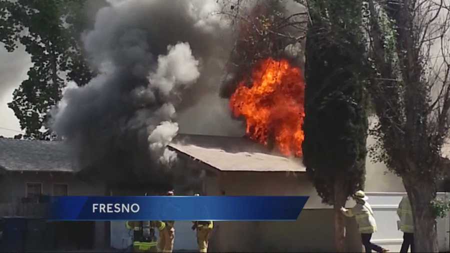 A Fresno firefighter was badly burned after he fell through the roof of a home while battling the blaze.