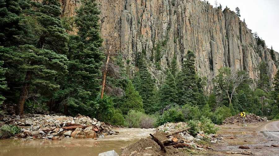 The small creek in North Pinol Canyon became a 20-foot-deep river on Saturday, according to New Mexico State Police.