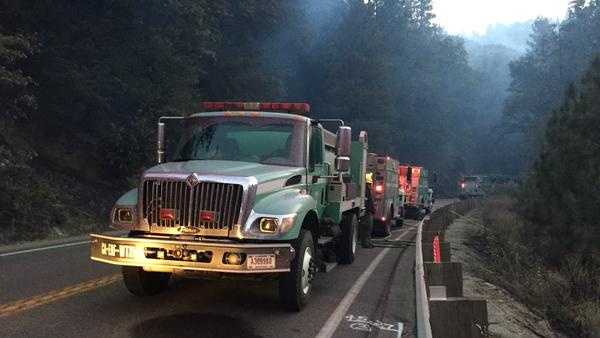 There is no work yet on when Highway 50 reopen. Fire trucks line the highway as crews climb the steep terrain.