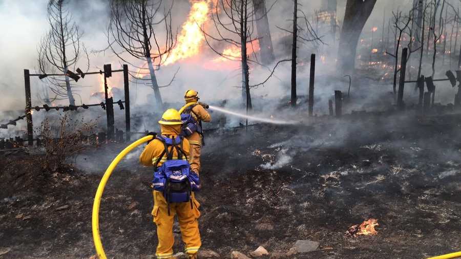 Firefighters battle the Butte Fire along Mountain Ranch Road. (Sept. 11, 2015)