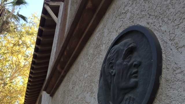 A plaque of Junipero Serra hangs outside Saint Francis of Assisi Catholic Church in Sacramento.