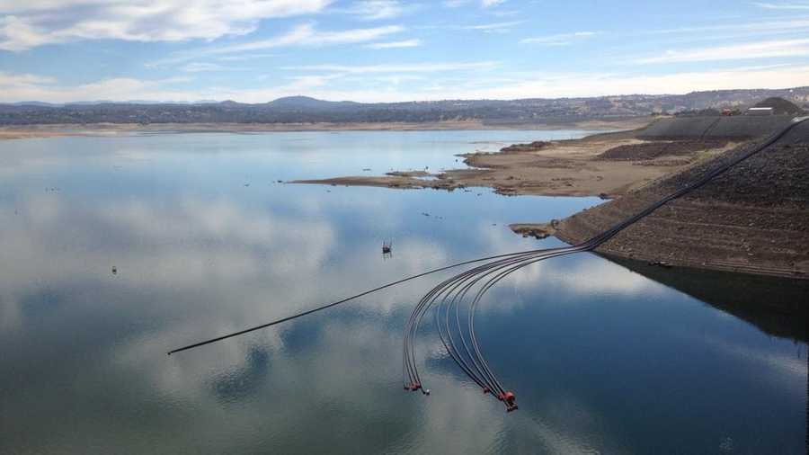 Pipes designed to pump water over Folsom Dam in case Folsom Lake water levels fall below the city's intake were connected with barges on Thursday, Sept. 24, 2015.