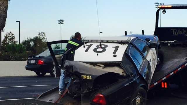 A Stockton CHP officer's car was on the side of Highway 99 at Morada Lane when it was struck by another vehicle Thursday. (Oct. 15, 2015)