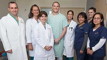 Airman Spencer Stone with his care team, from left to right: Associate Professor of Surgery Garth Utter, Nurse Practitioner Beth Maese, Fourth-Year Surgery Resident Eleanor Curtis, Nurse Practitioner Joyce Colobong, SICU Nurse Ruby Recta, Trauma Nurse Kaitlyn Morris and SICU Nurse Bernadette Beloy-Bachiller.