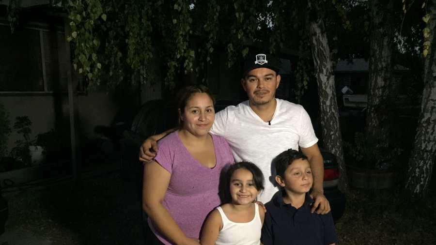 Maria Vidiro (top left); Juan Zavala (top right) and their two children stand in front of their West Sacramento home on Tuesday, Oct. 20, 2015. Zavala subdued a burglary suspect earlier in the morning.