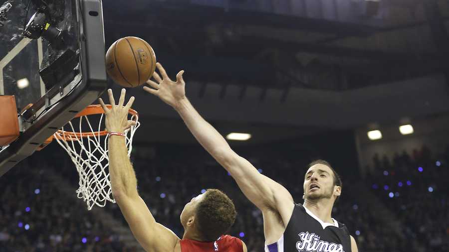 Los Angeles Clippers forward Blake Griffin, left, drives to the basket against Sacramento Kings center Kosta Koufos during the first quarter of an NBA basketball game in Sacramento, Calif., Wednesday, Oct. 28, 2015.