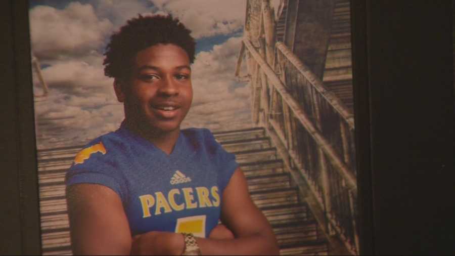 Dozens of people gathered Friday night to pay their respects at a viewing for a high school football player shot and killed before a playoff game two weeks ago.