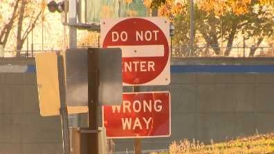 "Do Not Enter" sign stands at an exit ramp to warn drivers not to go on the ramp to enter the highway.