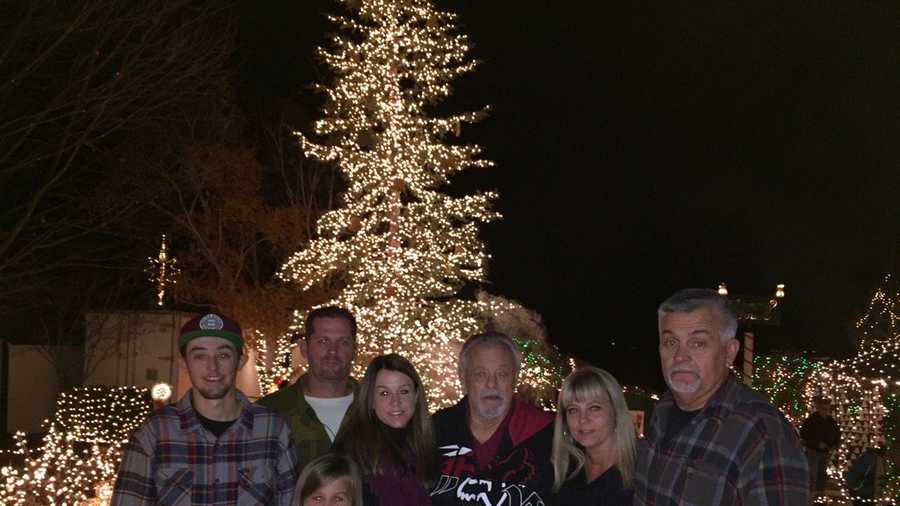 The Sassman Family stands in front of their farm's Christmas display on Monday, Dec. 7, 2015. The "Sassman Memory Farm" is in its finals days after drawing thousands of people for 23 years.