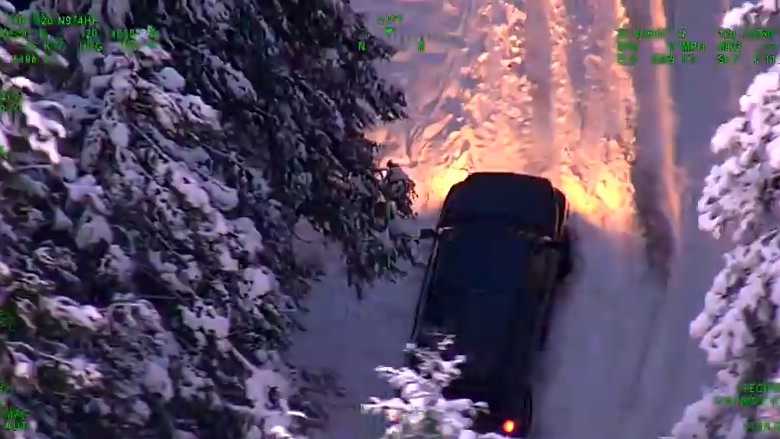 Video from a California Highway Patrol helicopter shows a truck stuck in the snow near Washington, Calif. on Monday, Dec. 14, 2015.
