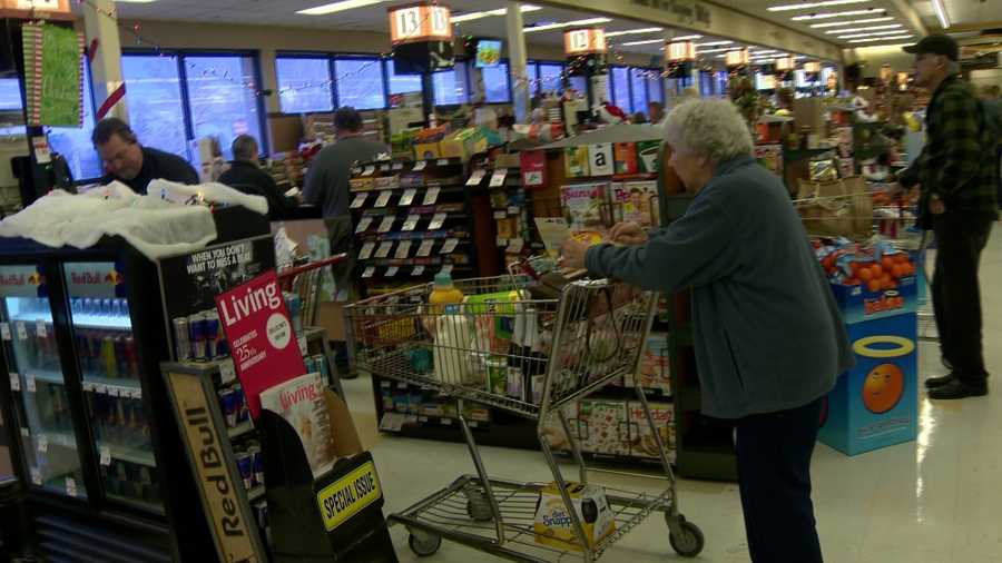 Customers stock up on Christmas and storms supplies at the Raley's supermarket in Placerville.