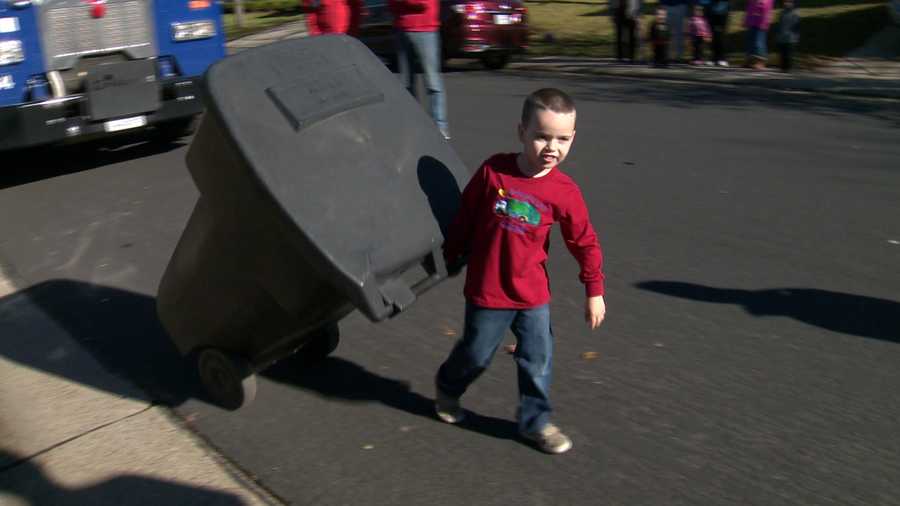 Jobiah Wells, 4, moves a trash can in his Folsom neighborhood on Friday, Dec. 25, 2015. The boy asked for four new trash bins for Christmas, and the city of Folsom stepped up to grant his wish.