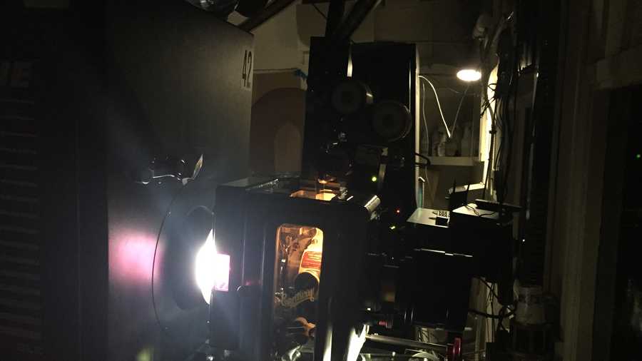 A side view of the 70 mm film projector at Sacramento's Tower Theater shows how light goes through the film from the left and the movie projects onto the screen from right. Tower Theater is one of 100 theaters in the country showing Quentin Tarantino’s latest movie, “The Hateful Eight,” in 70 mm film.