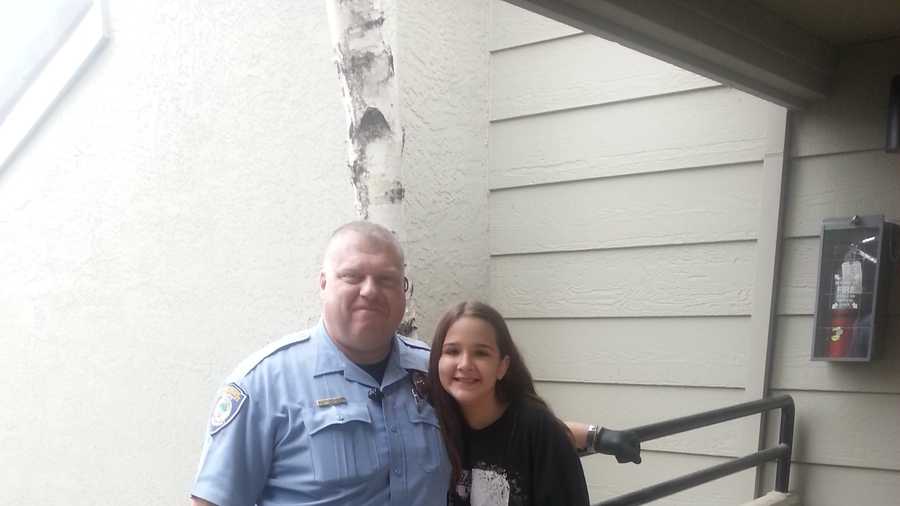 Citrus Heights police Officer Brian Wegesser and 11-year-old Anabelle Ward pose for a photo on Monday, Jan. 4, 2016, after her stolen bike was found and returned.