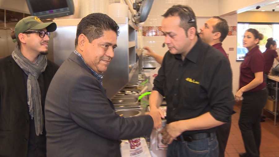 Rafael Armenta shakes hands with an employee at one of the El Pollo Loco restaurants he owns. Armenta started off as a dishwasher and worked his way up to owning 10 restaurants.