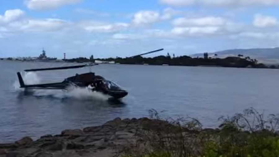 This screen grab of a YouTube video shows a civilian helicopter crashing into Pearl Harbor on Thursday, Feb. 18, 2016. Five people were injured in the crash.