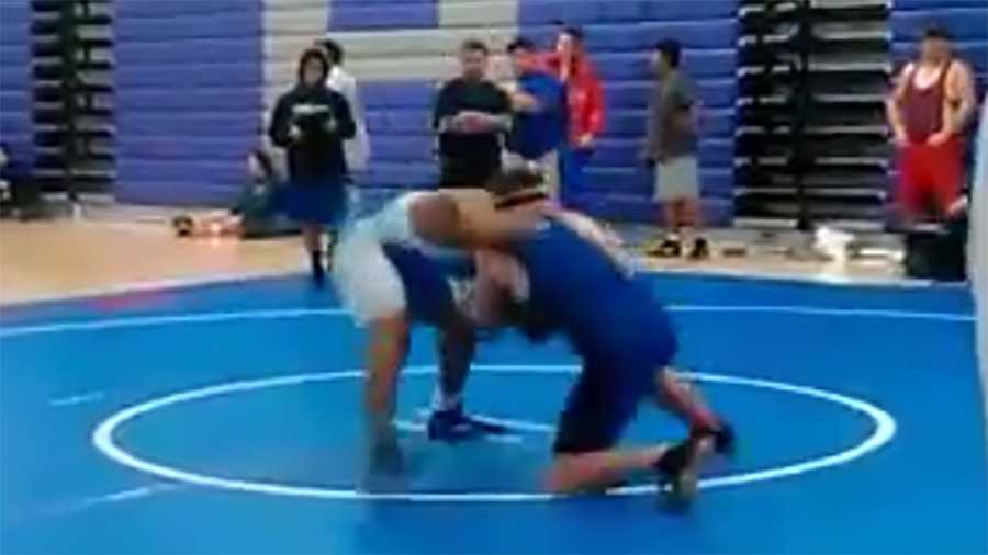 Bear Creek High School junior David DeLoach wrestles in during a regional tournament.