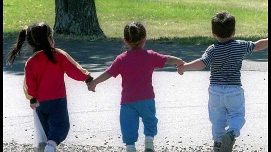 File photo: Children walking in a park.