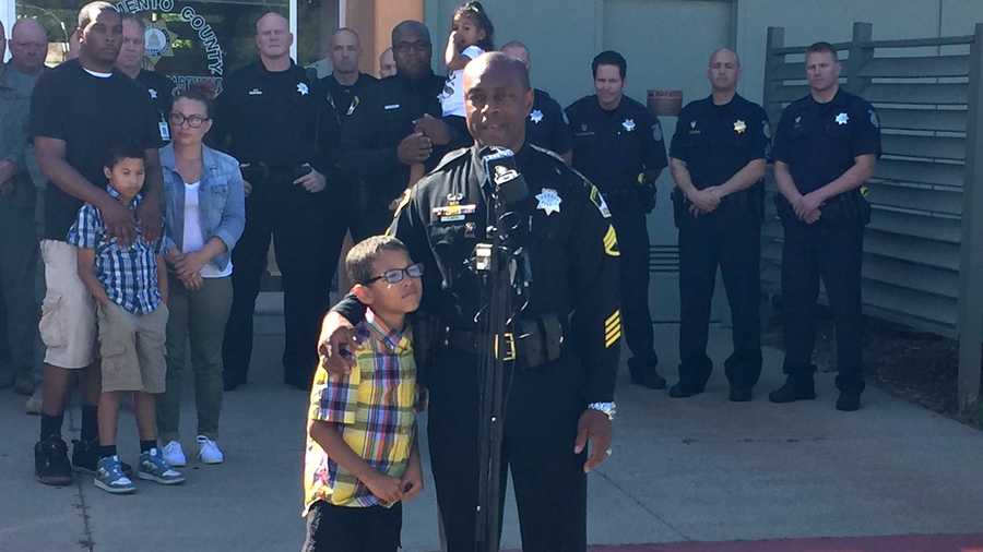 Michael Pittman Jr., 7, and Sacramento County Sheriff's Deputy Orlando Mayes reunite on Wednesday, June 9, 2016 -- six years after Michael was rescued from a 55-hour standoff.