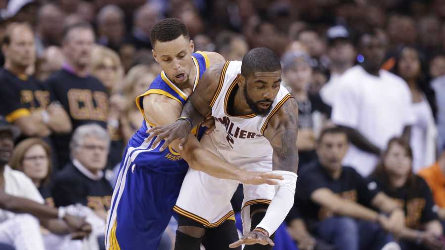 Golden State Warriors guard Stephen Curry (30) reaches against Cleveland Cavaliers guard Kyrie Irving (2) during the first half of Game 6 of basketball's NBA Finals in Cleveland, Thursday, June 16, 2016.
