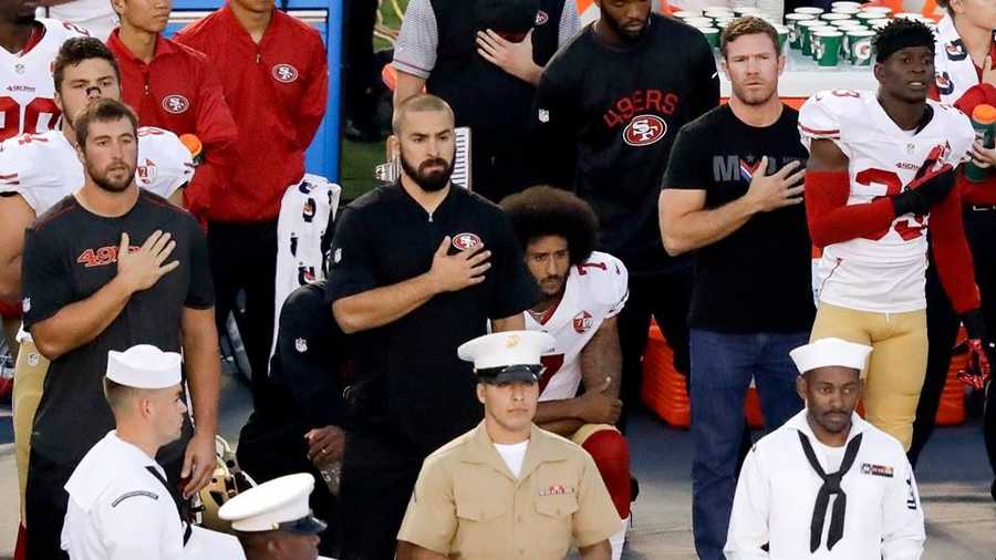 Colin Kaepernick is standing up to the National Football League