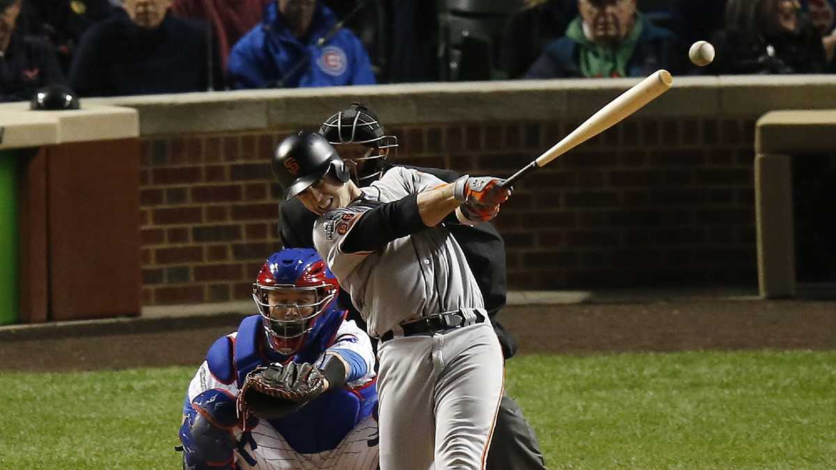 Chicago Cubs' Javier Baez runs the bases after hitting a home run off of  San Francisco Giants' Johnny Cueto during the eight inning of the game 1 of  the National League Division