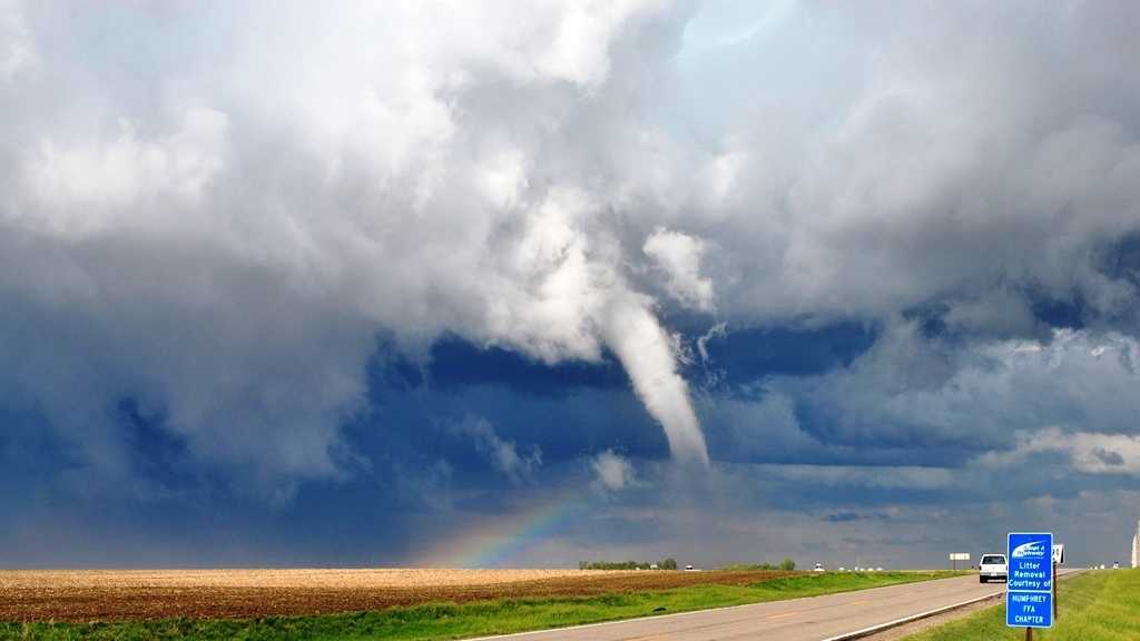Rainbow seen behind tornado