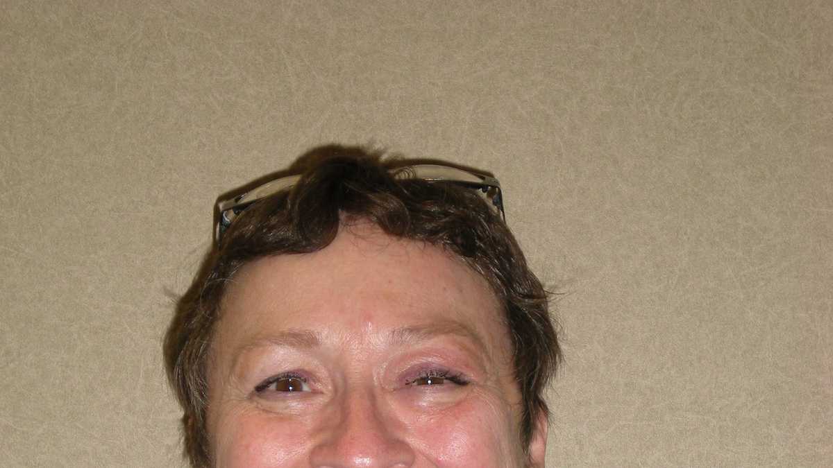 Woman killed when unoccupied car slides down driveway