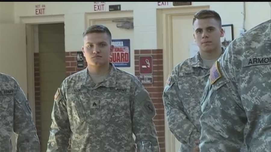 Two students put their education on hold to serve in Qatar with the National Guard for a year.