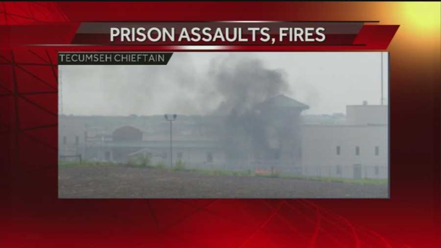 Flames are seen from the Tecumseh State Correctional Institution hours after two inmates were shot -- one with live ammunition, the other with rubber bullets.