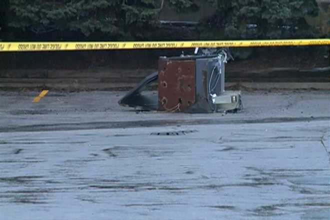 ATM ripped from platform, left in street