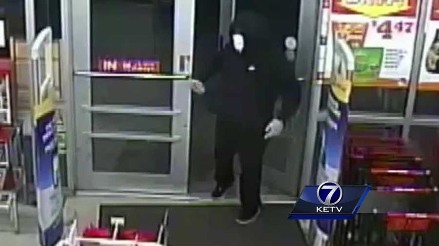 Omaha police are searching for two armed men who robbed a Family Dollar store on June 9.