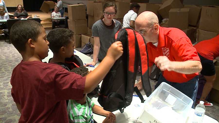Students pick up backpacks and supplies Friday at the Salvation Army's Kroc Center.