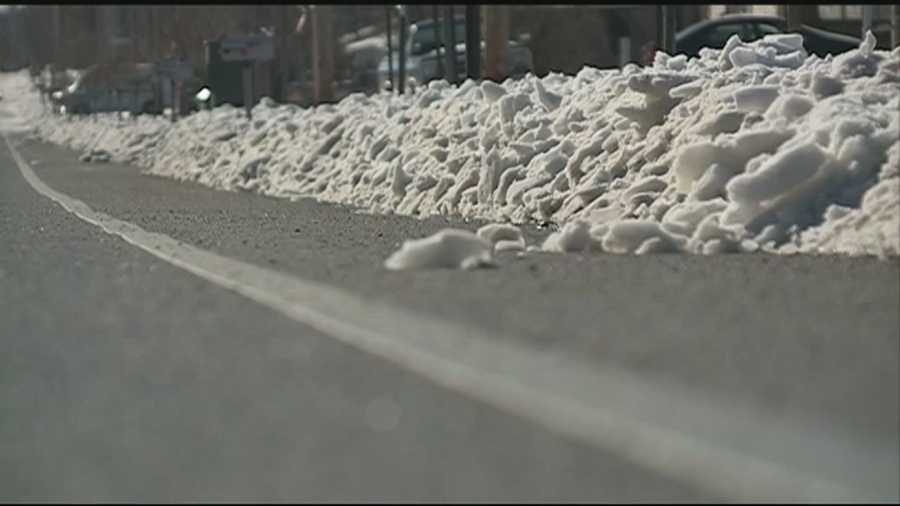 Some drivers say they're having a tough time getting over the piles of snow left behind by snow plows.