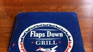 Flaps Down Grill is located in the Springdale Airport open terminal building.  Hours of Operation: Monday-Saturday with Lunch from  10:00 am-2:00 pm and Dinner from 4:30 pm-9:00 pm.