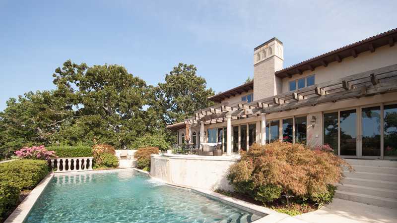 This beautiful Italian Villa inspired home includes a lavish designer pool.