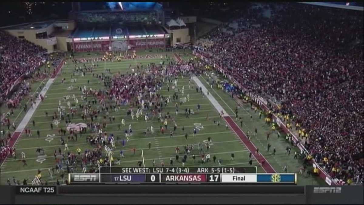University of Arkansas fined after football fans rush field