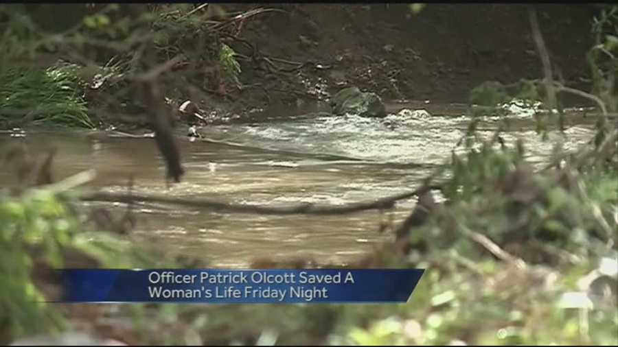 Springdale Police Officer saves woman from flood waters at Puppy Creek raod.