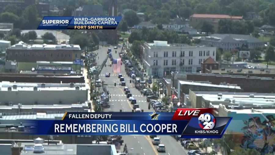 A procession led fallen deputy Bill Cooper's body to Oak Cemetery after his funeral Tuesday morning.
