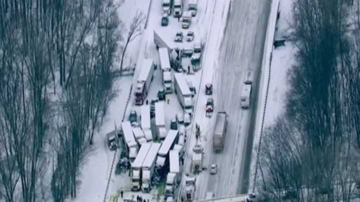 About 30 vehicles, half of the semitrailers, collided amid whiteout conditions in a massive highway pileup that left three people dead and more than 20 others injured in northwestern Indiana, police said.