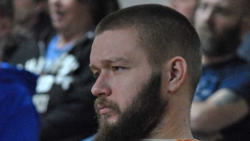 Kyle T. Flack, 28, Ottawa, who is charged in connection with the killing of three adults and an 18-month-old girl in spring 2013, listens to testimony about how the victims in the Ottawa-area quadruple homicide were killed Wednesday morning in Franklin County District Court, Ottawa. All four victims died as the result of gunshot wounds.