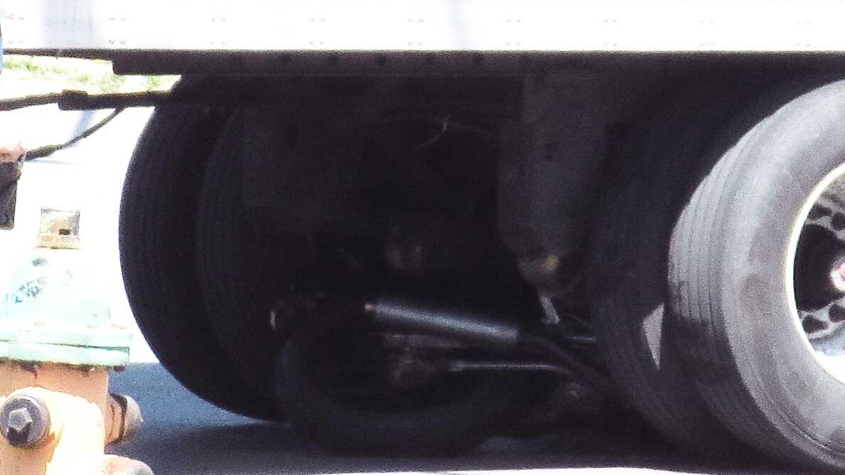 Images Motorcycle slides under tractor trailer