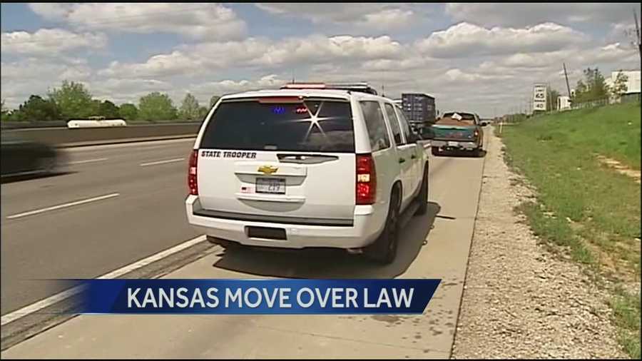 Kansas troopers warn drivers that they will be enforcing the state's move-over law, requiring people to change lanes as they pass an emergency vehicle on the shoulder of the road.