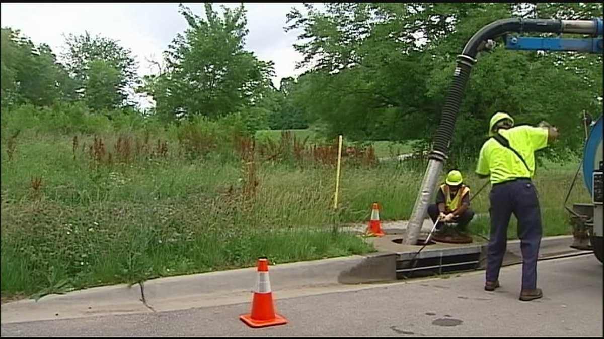 Crews work to clear storm drains as rain looms