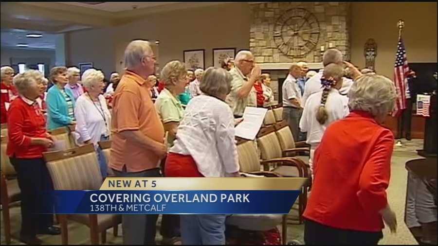 Hundreds of people gathered in Overland Park to help set a record for singing the national anthem.