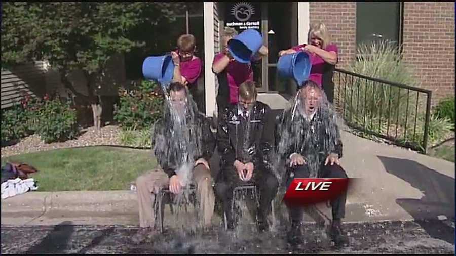 Three Independence dentists took part in the ice bucket challenge Thursday afternoon, including a father and son who have a special reason for doing so.