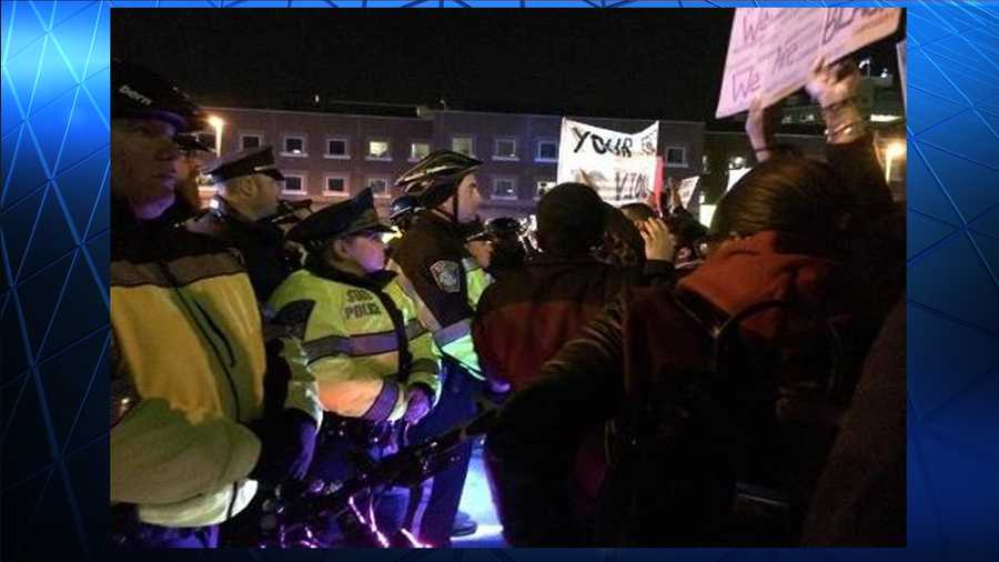 Protests continue nationwide in response to the grand jury decision in Ferguson, Missouri.  This photo shows one in the Boston area late Tuesday.  
