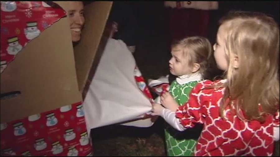 A Fort Leavenworth, Kansas soldier coming home for Christmas leave wraps himself up as a present to surprise his daughters.